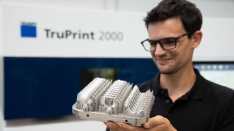 TRUMPF employee in front of TruPrint2000-2402